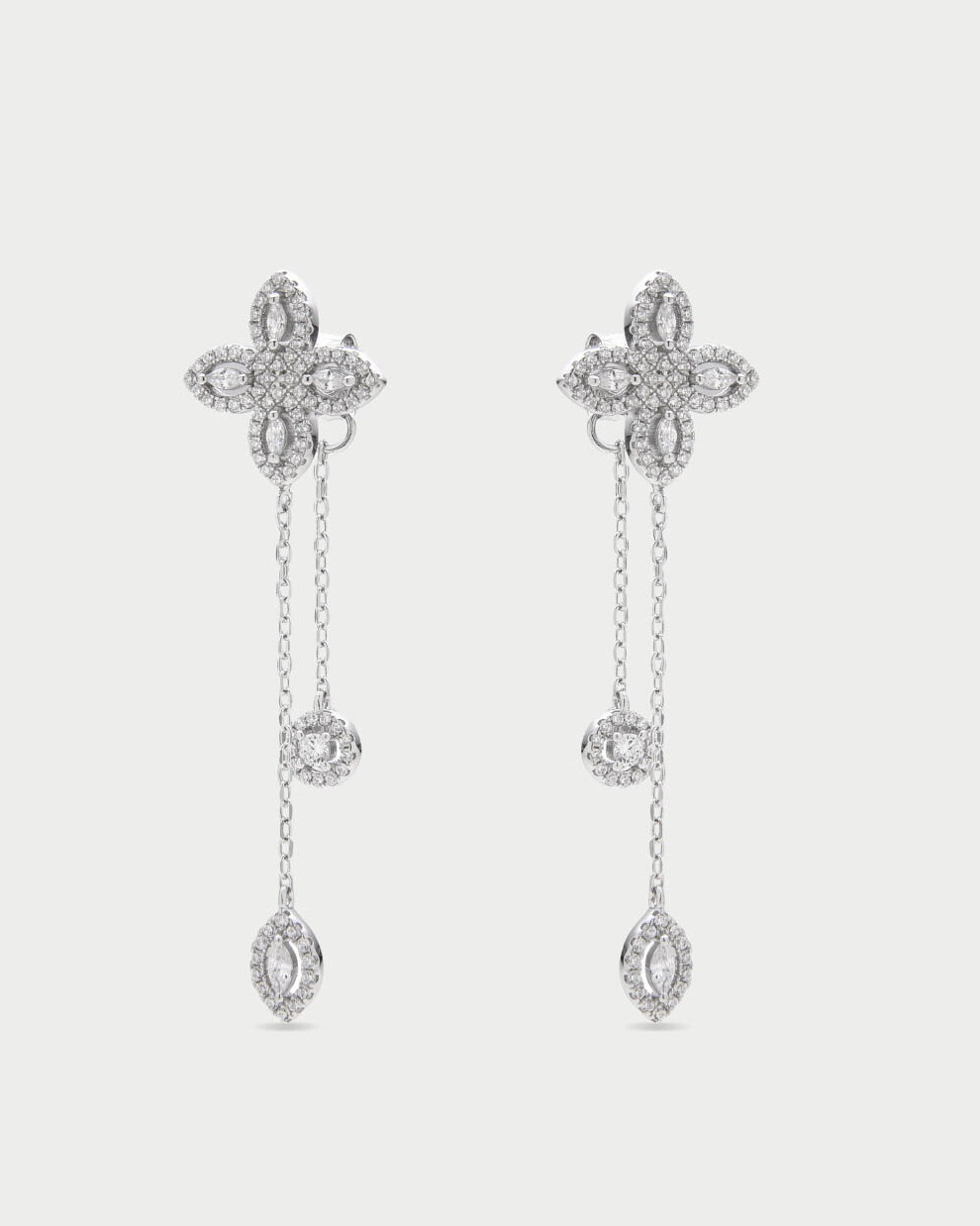 Boucles d’oreilles « Doubles Pendantes Fleur de Vie » en argent 925 rhodié, design pendulaire avec deux motifs floraux « Fleur de Vie » ornés de zirconiums taille marquise et ronde, finition polie brillante.