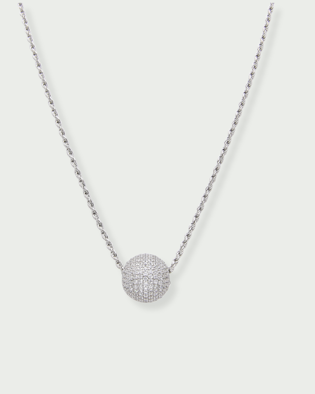 Collier « Atlas » en argent 925 rhodié, pendentif composé d’une boule pavée de zirconiums blancs, chaine torsadée.