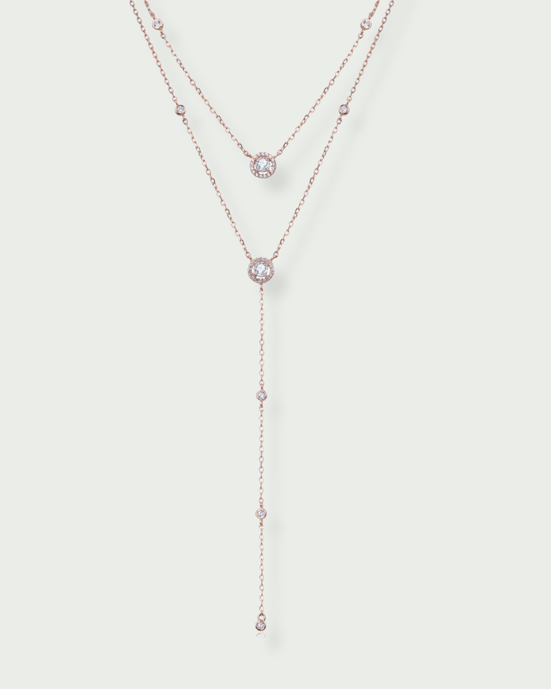 Collier double rang en argent 925 doré a l'or ROSE 18K rhodié avec motifs ronds pavés et pampille centrale sertie de zircons en noir et blanc.