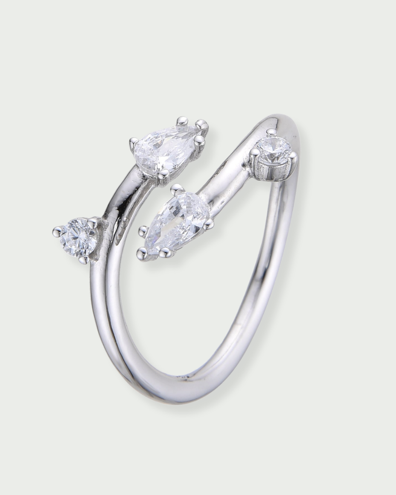 Bague lisse argent 925 rhodié et zirconiums tailles poire et brillants façon branches subtiles