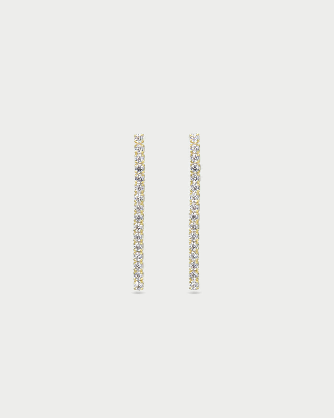Boucles d’oreilles Rivière Intemporel dorées en argent 925 rhodié à l’or 18 carats avec une rangée de zirconiums ronds scintillants alignés, design long et élégant pour une allure sophistiquée et lumineuse.