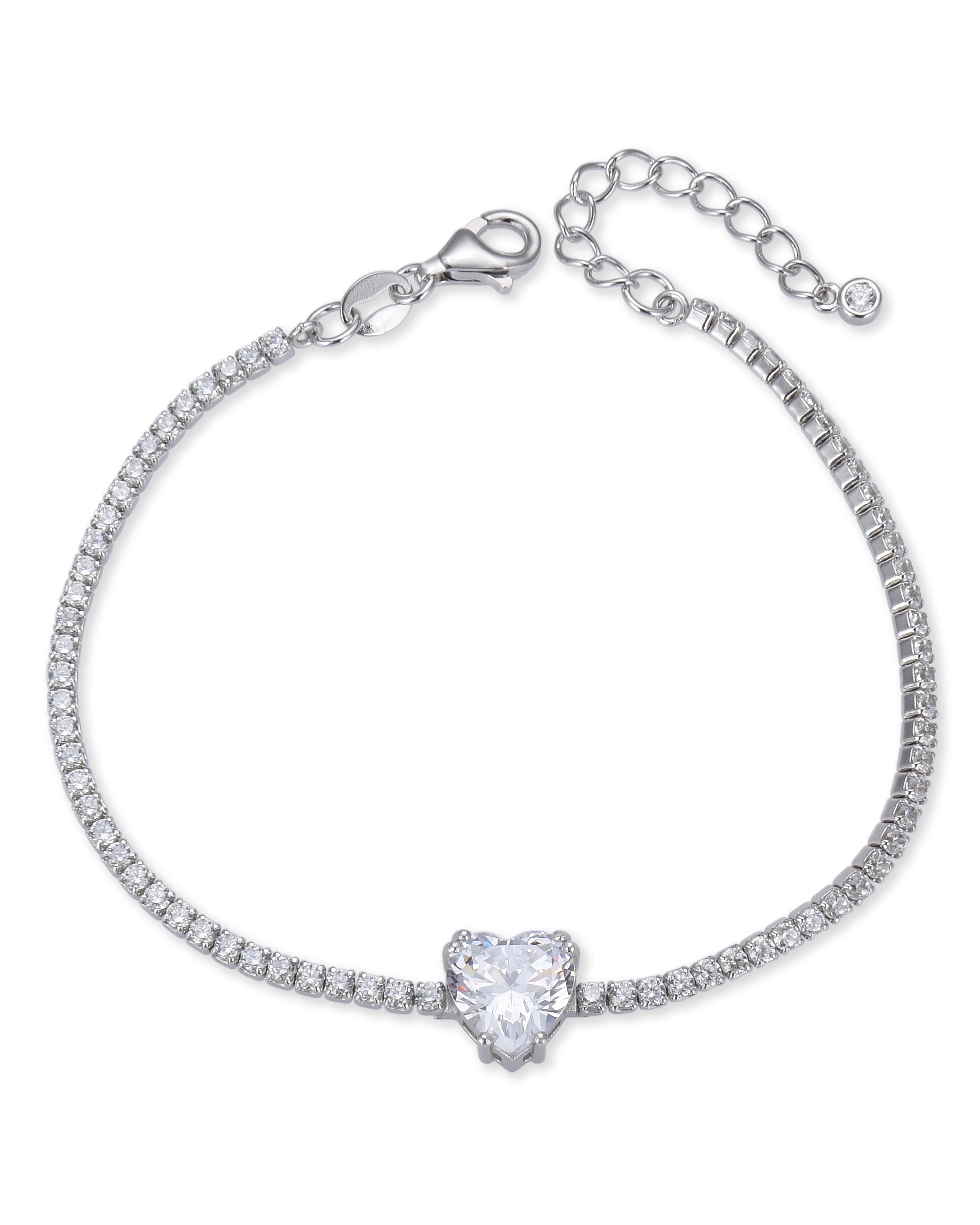Bracelet « Tennis Cœur » en argent 925 rhodié, rangée continue de pierres blanches sublimée par un cœur de zirconium.