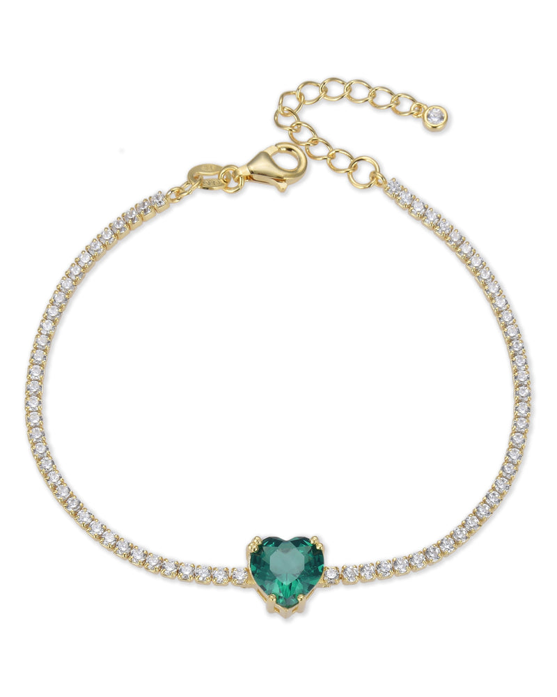 Bracelet « Tennis Cœur » en argent 925 doré à l'or 18 carats doré, rangée continue de pierres blanches sublimée par un cœur vert en zirconium.
