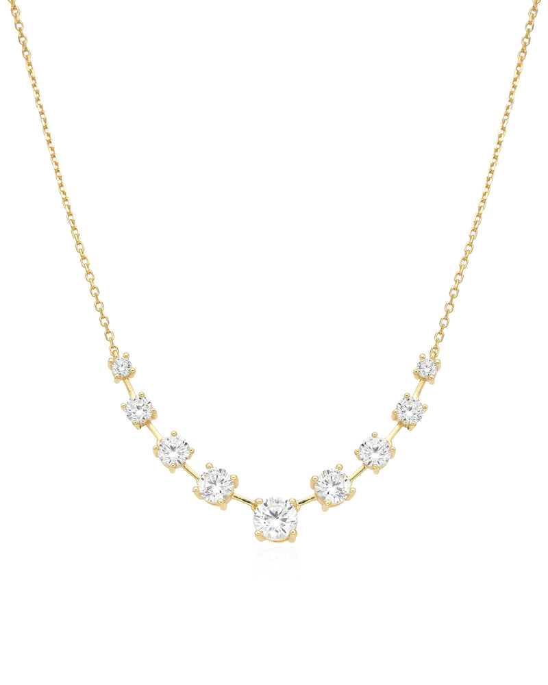 Bracelet « My Glow » en argent 925 doré à l'or jaune 18 carats, orné de plusieurs pierres blanches facettées de différentes tailles, montées sur une chaîne fine, finition polie brillante.