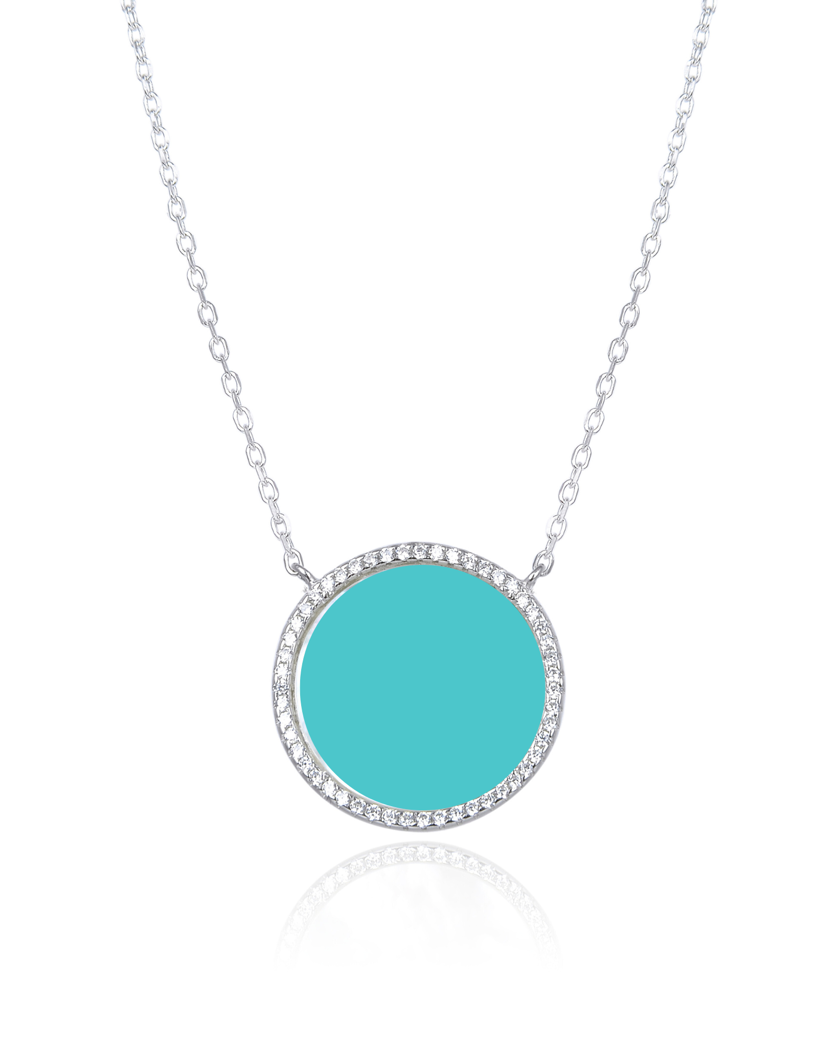 Collier en argent 925 rhodié, orné d’une grosse médaille ronde sertie d’une pierre turquoise, finition polie brillante.