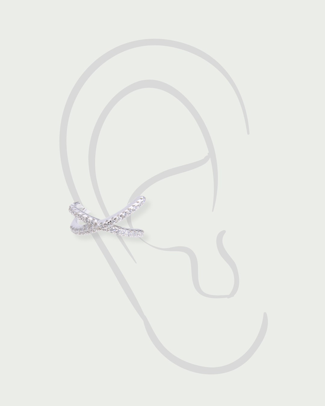 Earcuff Croisé Intemporel – Blanc en argent 925 rhodié, lignes entrelacées au design structuré et contemporain, finition polie brillante résistante à l’oxydation, format ajustable à clipser sans piercing, imaginé pour illuminer l’oreille d’une touche graphique et élégante, à porter seul ou en accumulation.
