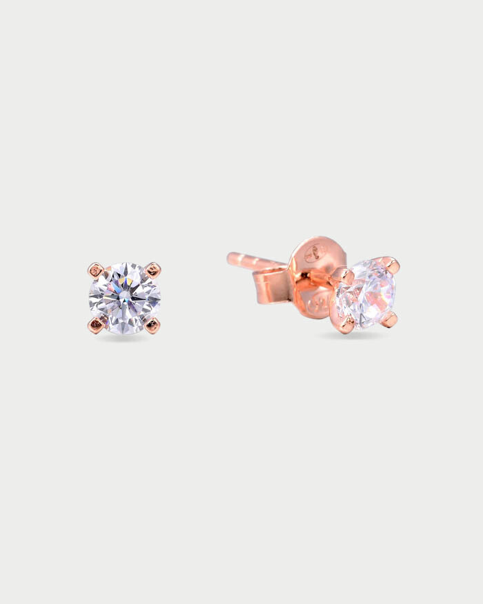 Puces Intemporel rose taille L GENA Jewelry en argent 925 doré à l’or rose, ornées d’un zircon rond serti quatre griffes.