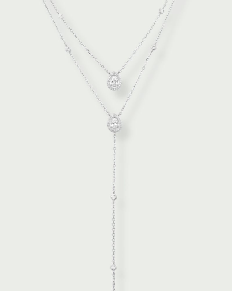 Sautoir « Double Infini Poire » en argent 925 rhodié, double chaîne élégante ornée de zirconiums taille poire, finition polie brillante.