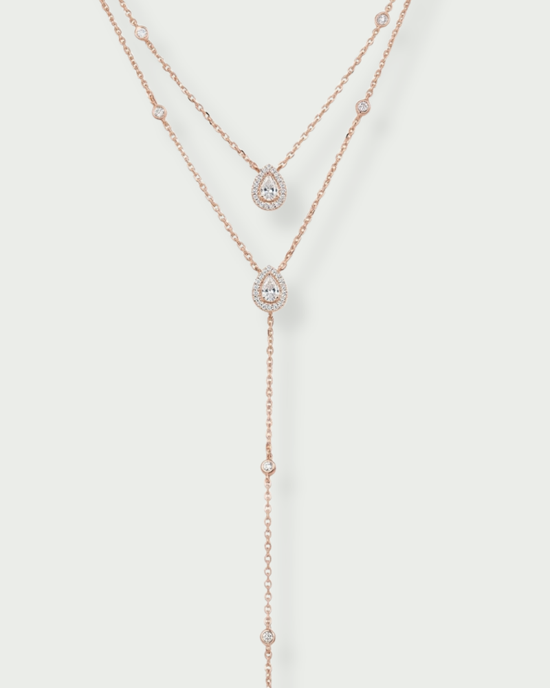 Sautoir « Double Infini Poire » en argent 925 doré à l’or rose 18 carats, double rang dont un rang choker orné de pierres en zirconium taille poire, finition polie brillante.