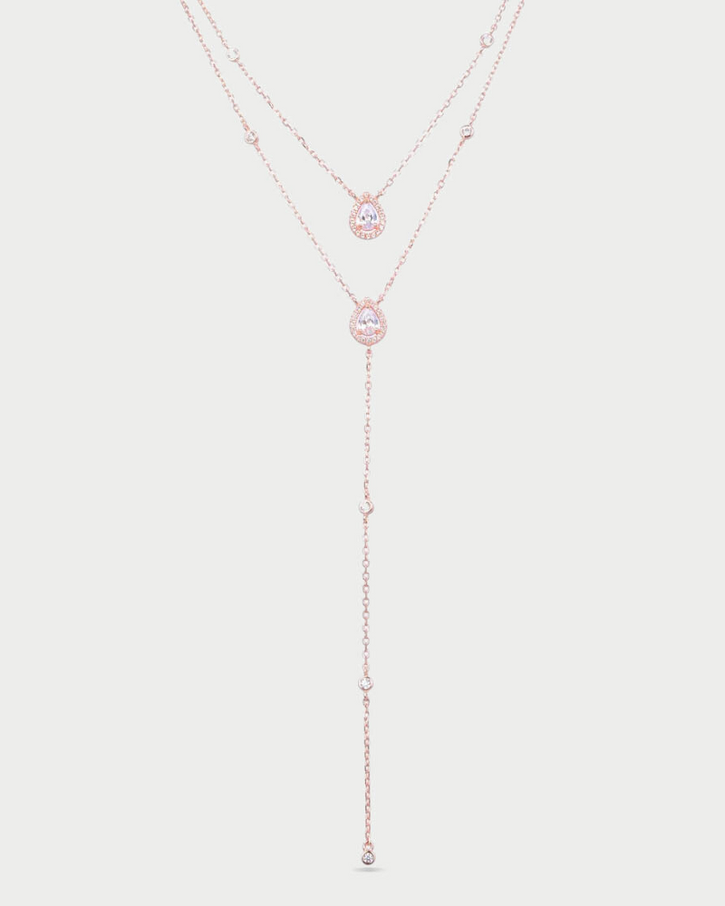 Sautoir « Double Infini Poire » en argent 925 doré à l’or rose 18 carats, double rang dont un rang choker orné de pierres en zirconium taille poire, finition polie brillante.