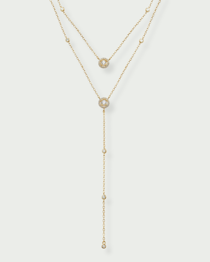 Sautoir Double Infini Rond – en argent 925 Doré a l'or jaune 18K rhodié, double chaîne fine ornée de pendentifs ronds délicatement sertis, finition polie brillante résistante à l’oxydation, éclat pur et élégant.
